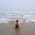 child-meditating-by-ocean