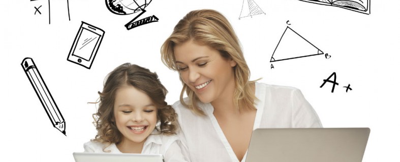 mother helping daughter with homework using tablet and laptop